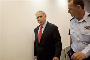 Israel's PM Netanyahu and his aide-de-camp Locker arrive for cabinet meeting in Jerusalem