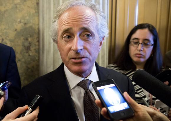 Senator Bob Corker (R-TN) speaks to reporters during the 14th day of the partial government shut down in Washington in this file photo taken October 14, 2013. CREDIT: REUTERS/JOSHUA ROBERTS/FILES