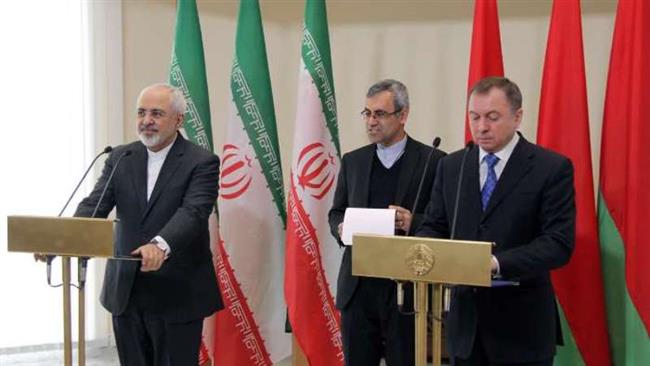 Iran’s Foreign Minister Mohammad Javad Zarif (L) and his Belarusian counterpart Vladimir Makei meet in Belarus’ capital Minsk on February 17, 2015 before attending a joint press conference.