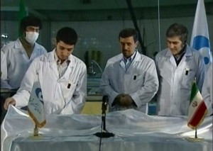 Ahmadinejad loads fuel rods into reactor