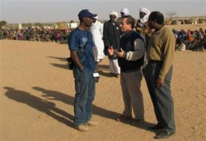 Actor Don Cheadle, U.S. Representative Ed Royce and Paul Rusesabagina visit a refugee camp on the Chad-Sudan border in this handout photo