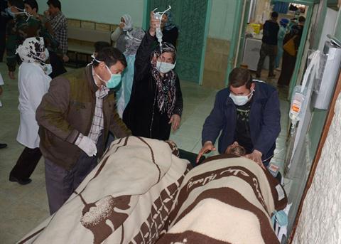 Syrian victims who suffered an alleged chemical attack at Khan al-Assal village according to SANA, are covered by blankets as they receive treatment, at a hospital in Aleppo, Syria, Tuesday March 19, 2013. (AP Photo/SANA)