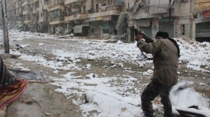 A militant is seen clashing with Syrian government forces in the Salaheddin neighborhood of Syria's Aleppo on December 11, 2013.