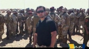 Iranian-American Amir Mirza Hekmati, who has been sentenced to death by Iran's Revolutionary Court on the charge of spying for the CIA, stands with Iraqi soldiers in this undated still image taken from video in an undisclosed location made available to Reuters TV on January 9, 2012.