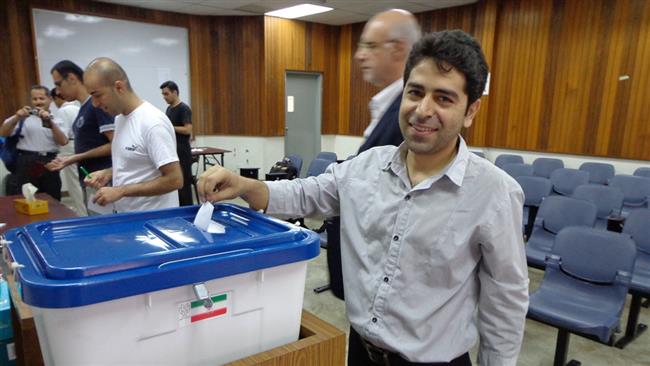 An Iranian national in Malaysia casts his ballot in the 11th presidential election which was held in May 2014.