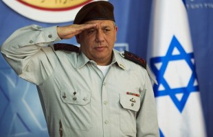 The new Israeli Chief of Staff Lieutenant-General Eizenkot salutes during a handover ceremony in Jerusalem