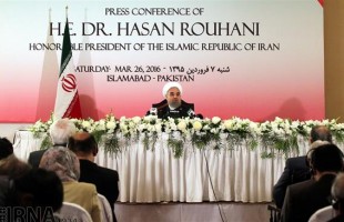 Rouhani speaks at a press conference in Pakistan