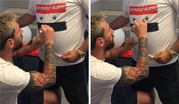 Messi Signs T-Shirt of Pro-Assad Fan