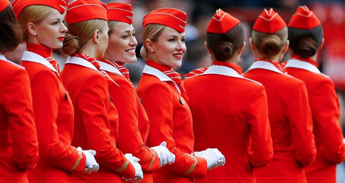 attractive hospitality uniform- booking the plane ticket